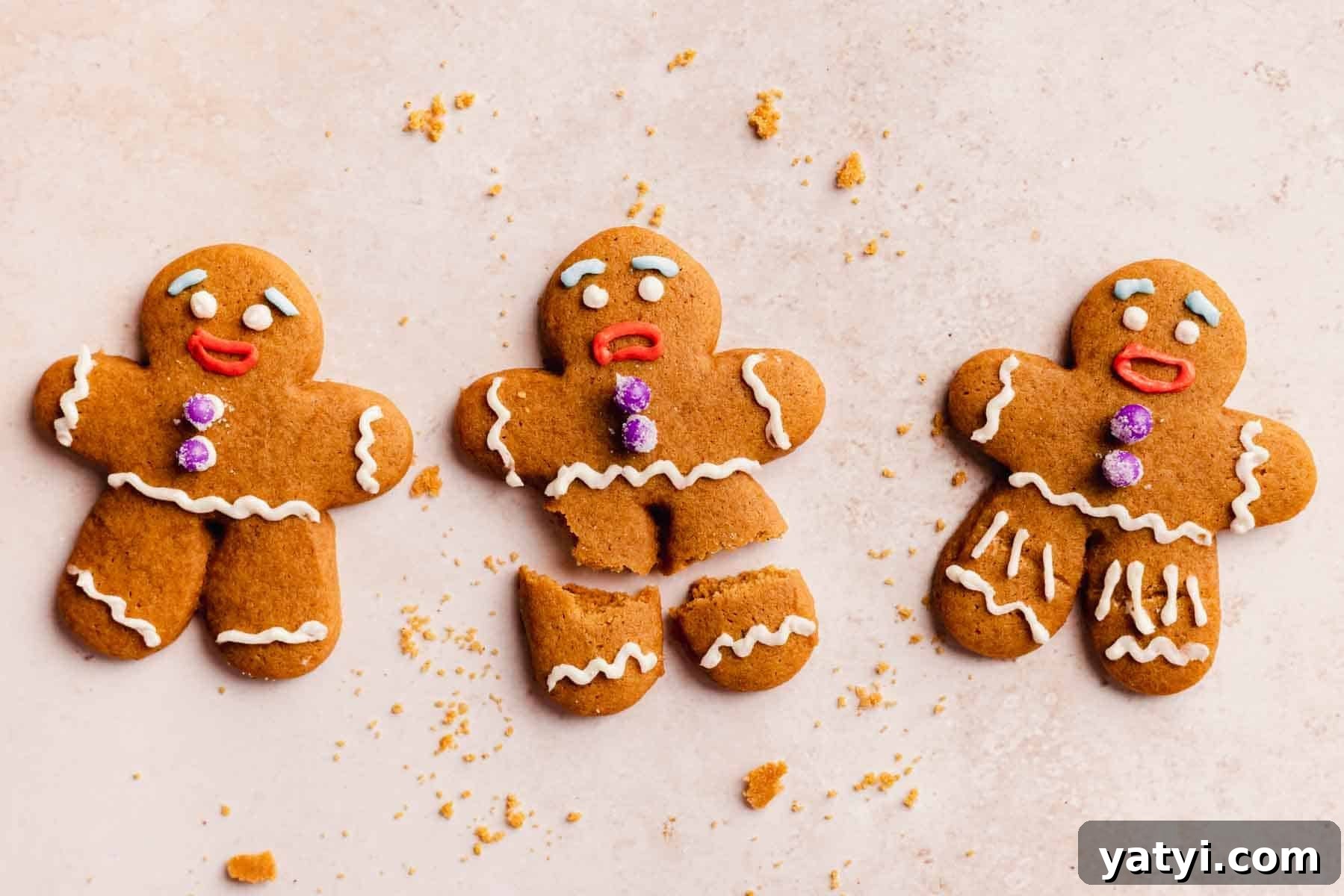 gingerbread men decorated like Gingy from shrek in different stages of broken legs