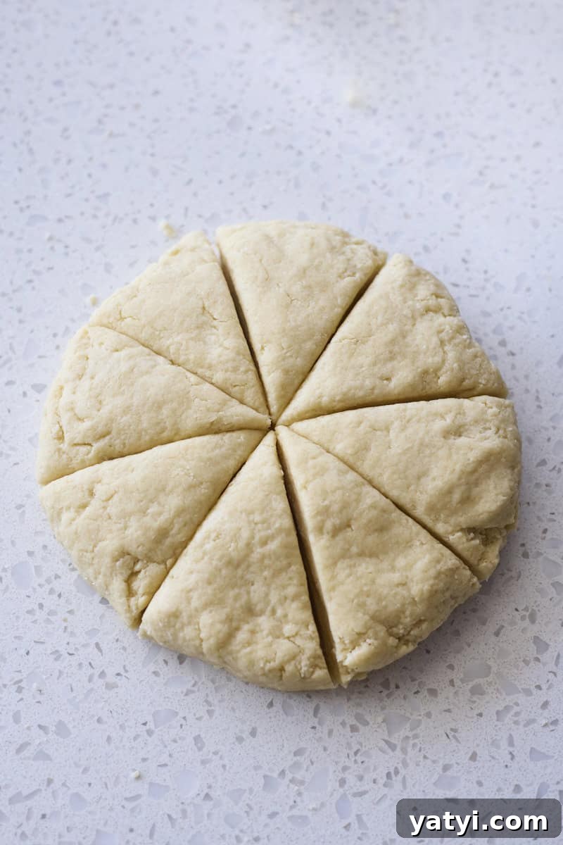 Sourdough Discard Scone Recipe: Flaky Base for Sweet or Savory Add-Ins 9 Dough cut into 8 triangles.