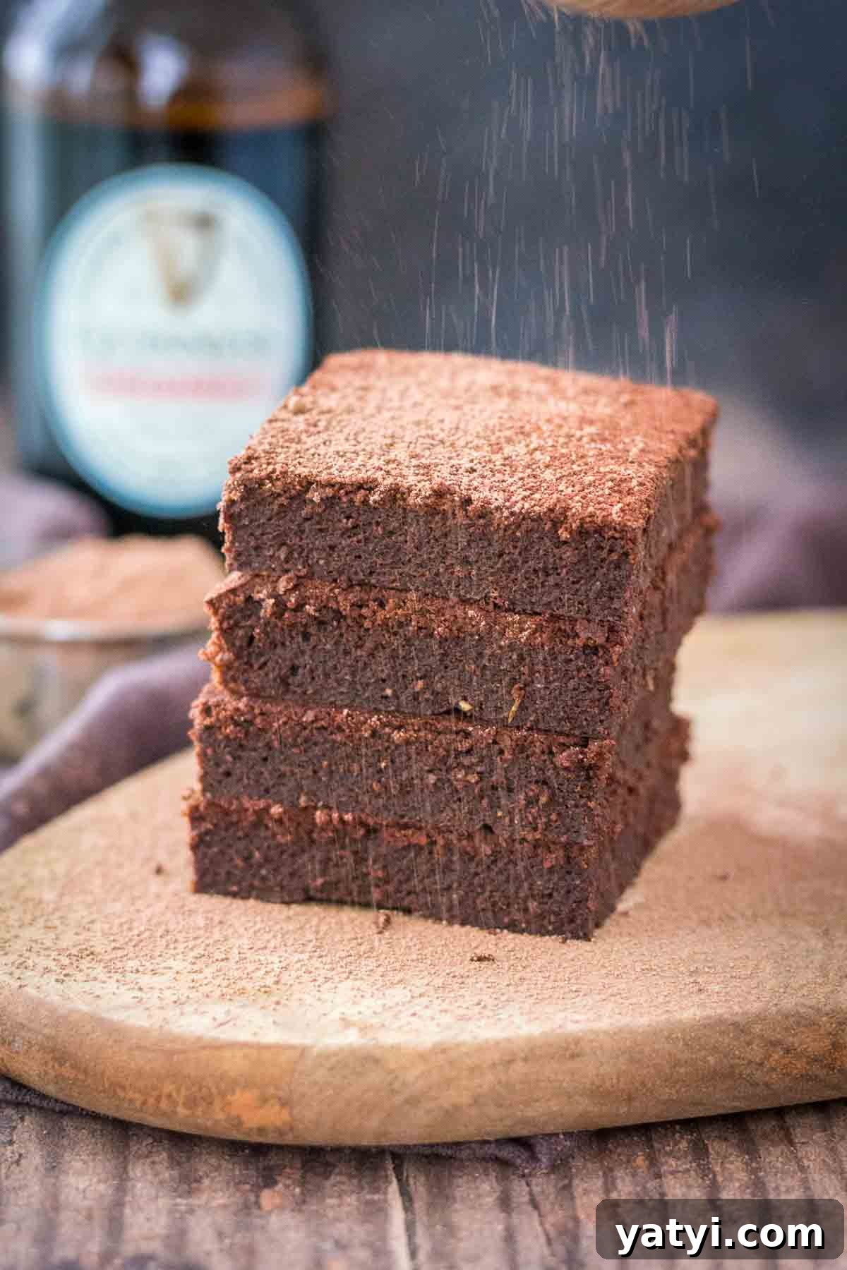 Guinness Chocolate Brownies with Rich Stout Flavor 5 Dusting chocolate Guinness brownies with cacao powder