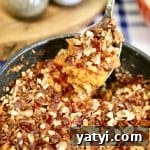 Maple-Glazed Grilled Sweet Potato Casserole for Summer BBQ 3 Spoonful of sweet potato casserole in a bowl.