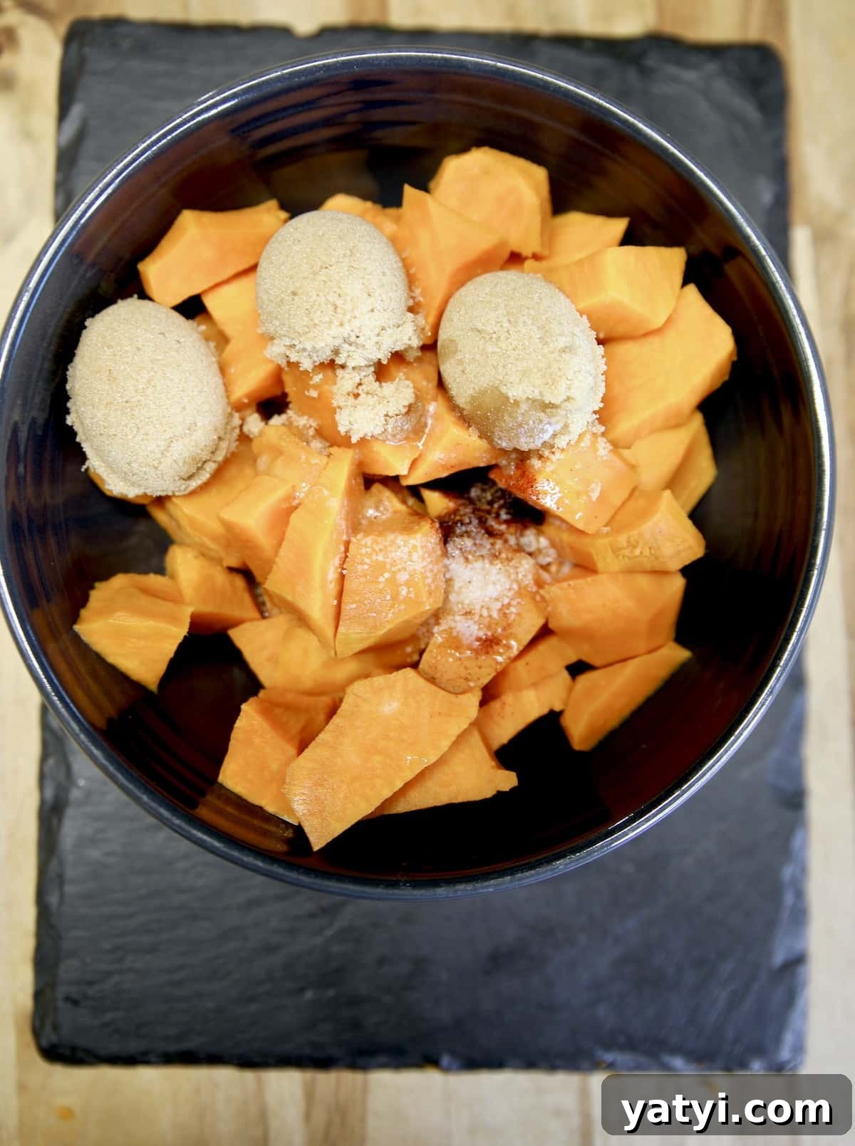 Maple-Glazed Grilled Sweet Potato Casserole for Summer BBQ 2 Bowl of chopped sweet potatoes with brown sugar & butter.