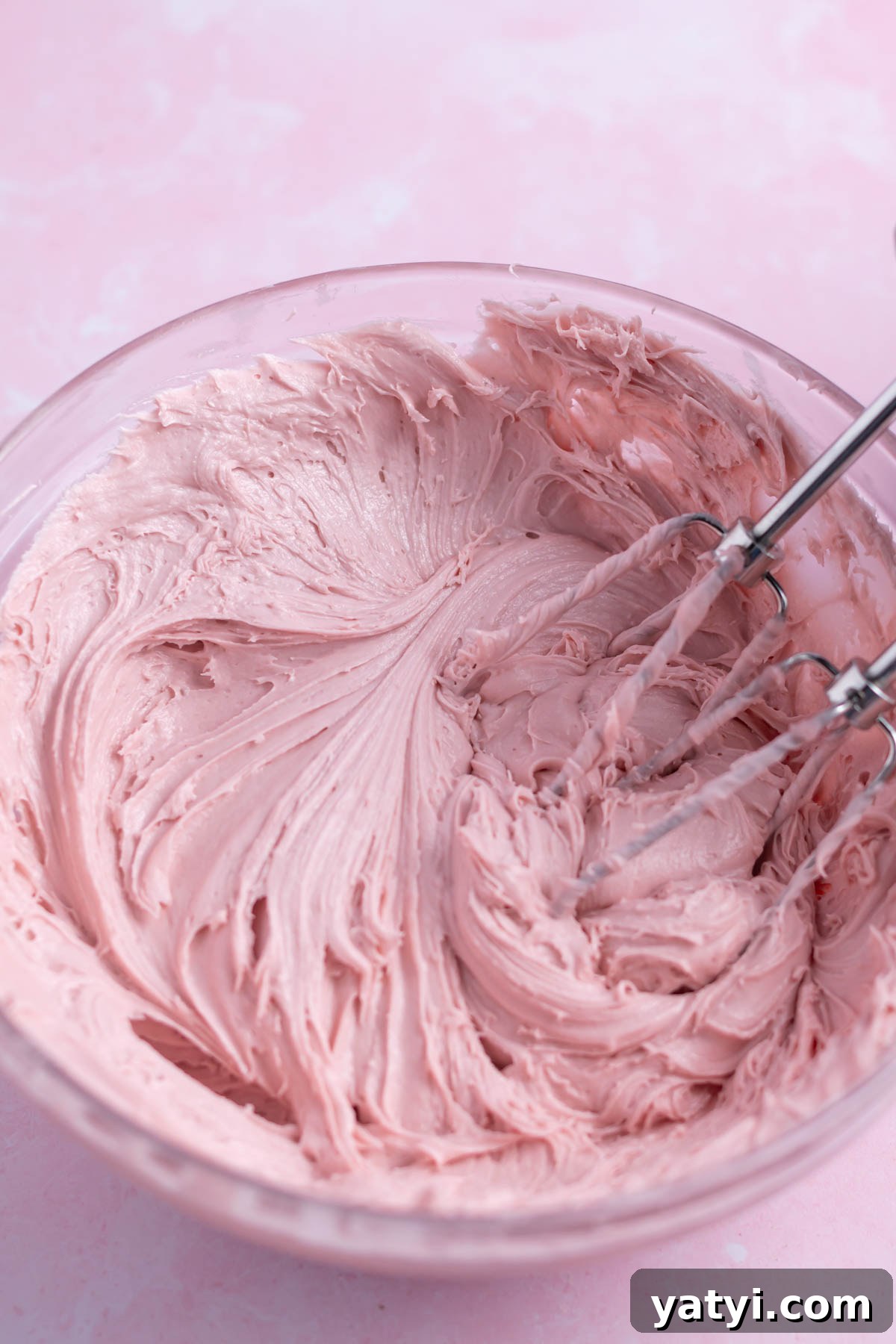 Moist Chocolate Cupcakes with Raspberry Filling and Ganache 15 raspberry ganache in a mixing bowl with the mixing beaters.