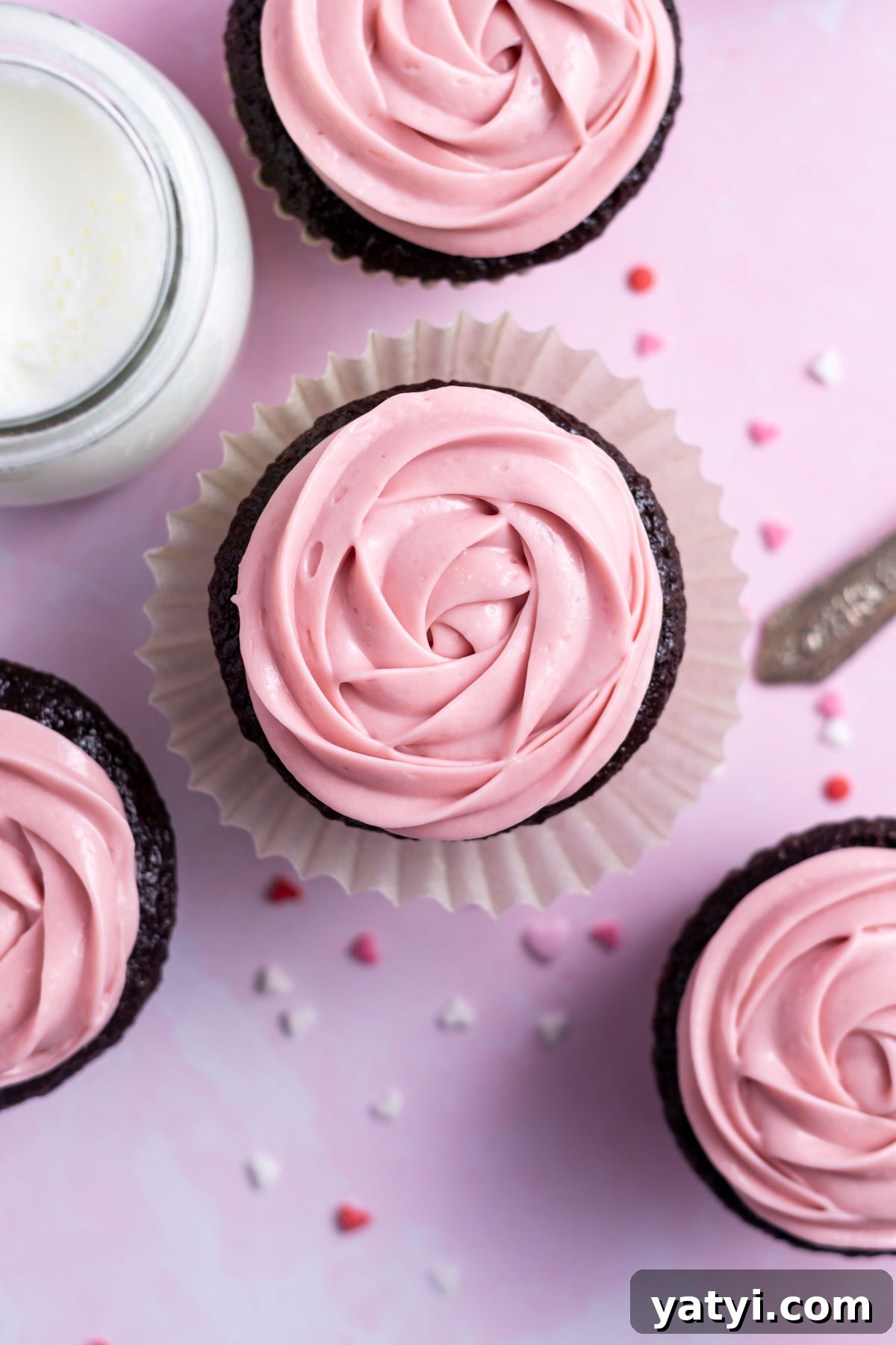 Moist Chocolate Cupcakes with Raspberry Filling and Ganache 17 overhead look at pink chocolate ganache piped on chocolate cupcakes