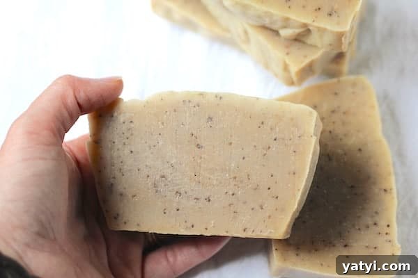 45 Homemade Stocking Stuffer Ideas Kids and Adults Will Love 6 Photo shows a hand holding a bar of coffee scrub soap