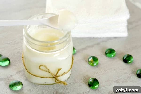 45 Homemade Stocking Stuffer Ideas Kids and Adults Will Love 9 Photo shows a jar of sugar scrub with a white spoon on top