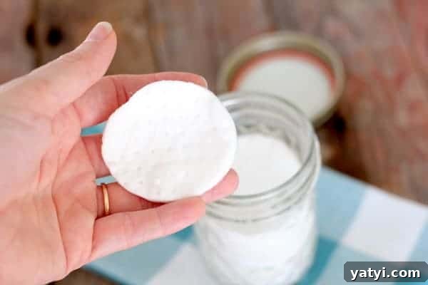 45 Homemade Stocking Stuffer Ideas Kids and Adults Will Love 10 Image shows a hand holding a round pad over a jar on a table