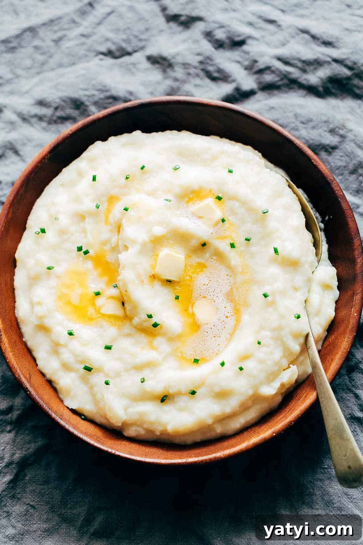 Creamy Garlic Mashed Potatoes in the Instant Pot (Pressure Cooker) 2 Mashed potatoes flavored with garlic and served in a wooden bowl.