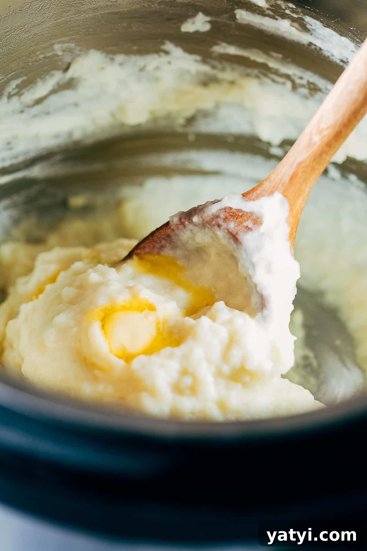 Creamy Garlic Mashed Potatoes in the Instant Pot (Pressure Cooker) 3 Blending the mashed potatoes.