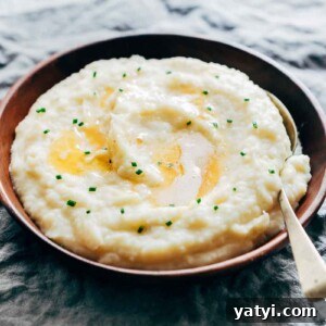 Creamy Garlic Mashed Potatoes in the Instant Pot (Pressure Cooker) 8 Mashed potatoes flavored with garlic and served in a wooden bowl.