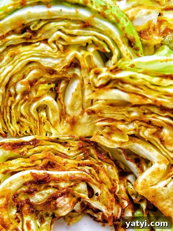 Savory Sausage and Cabbage Skillet Recipe for Weeknight Dinners 14 air fryer Asian cabbage steaks on a plate.