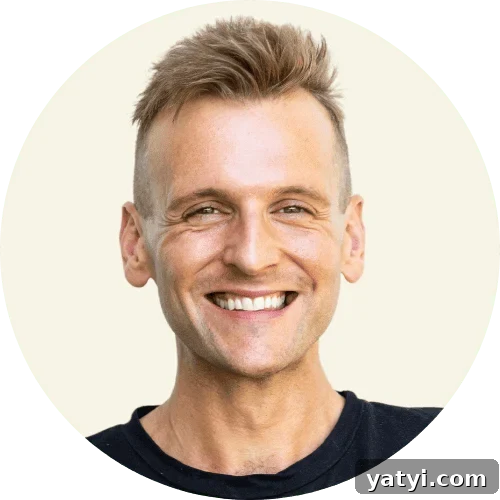 Chewy Cinnamon Apple Pie Bars: Easy Recipe for Fall Baking 2 Kaleb Wyse wearing a black shirt standing in front of a taupe background.
