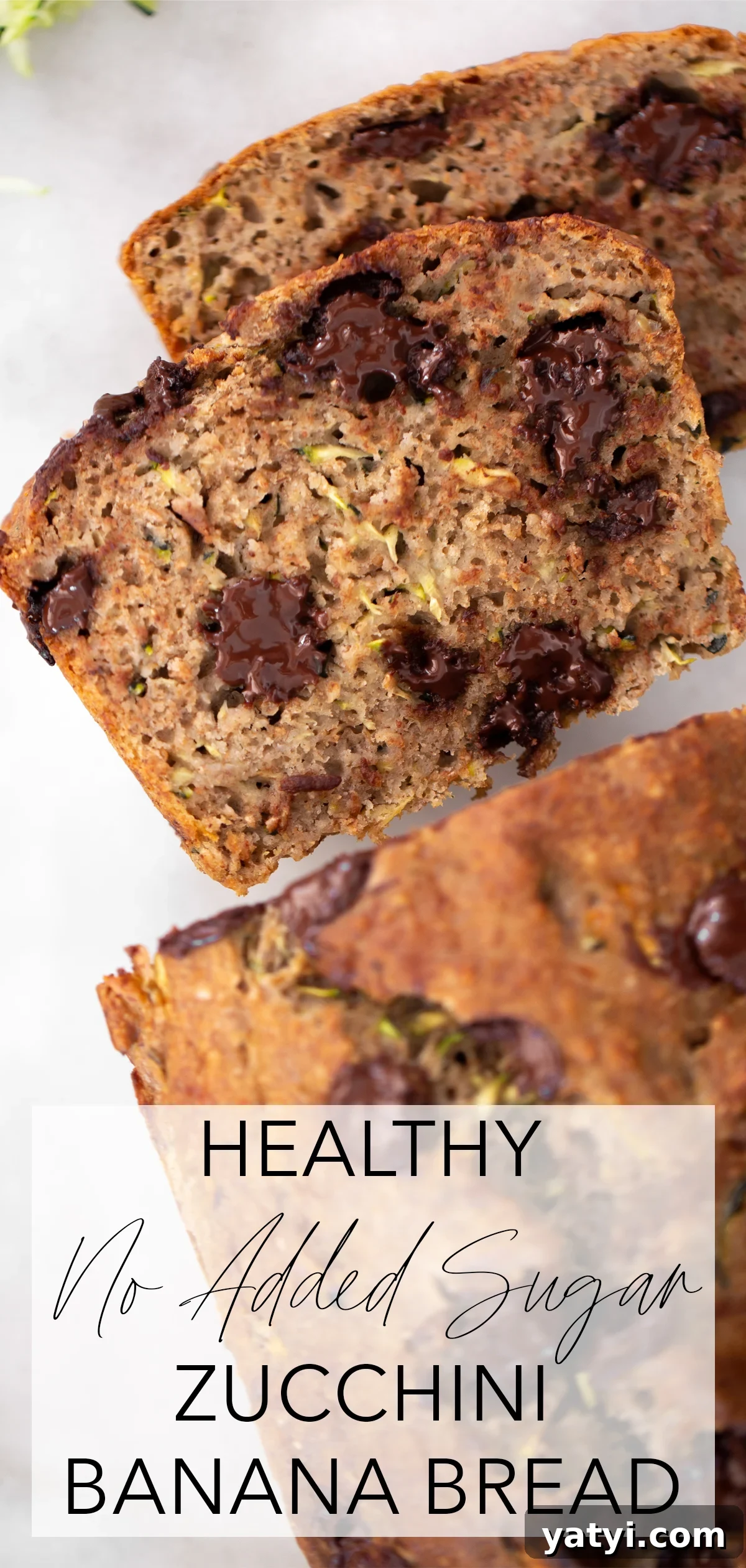 No-Added-Sugar Zucchini Banana Bread Recipe for Moist Loaves 6 Overhead shot of 2 slices of healthy zucchini banana bread with the rest of the loaf on a white marble background with title text overlay