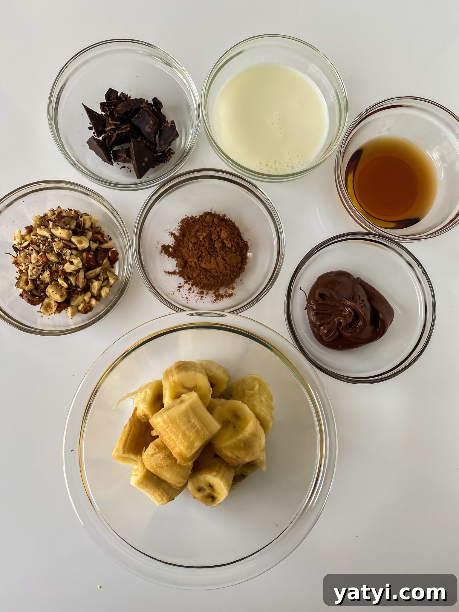 Chocolate Hazelnut Smoothie Bowl: Creamy Breakfast Recipe 3 Ingredients: Bananas, Nutella, Cocoa Powder, Maple Syrup, Milk or Nut Milk, Nuts and Chocolate optional.