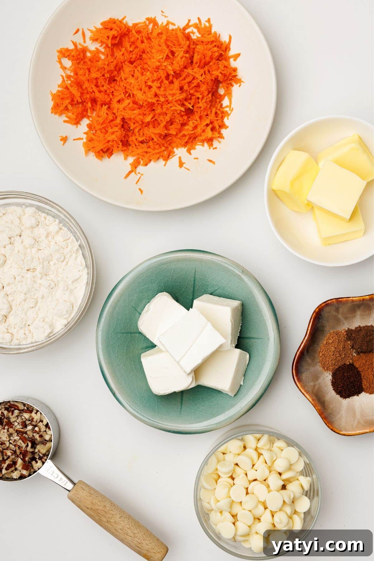 Keto Carrot Cake Protein Bites Recipe for Low-Carb Snacks 3 Overhead flat lay of grated carrots, cream cheese, butter, protein powder, spices, white chocolate chips, and pecans
