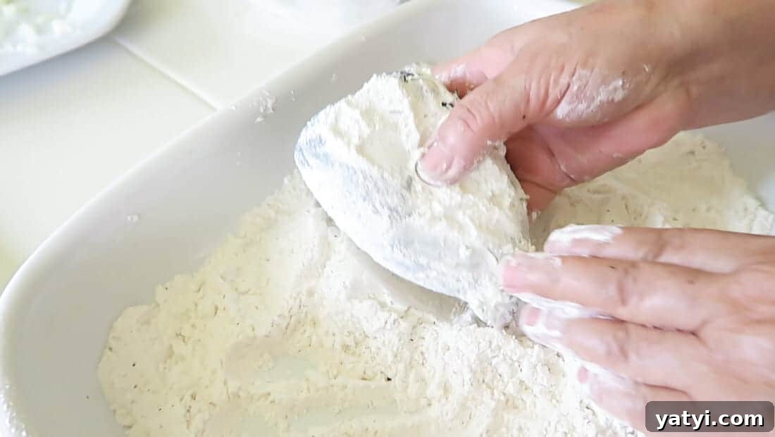 Authentic Chiles Rellenos: Mom’s Homemade Recipe with Video 14 rolling the stuffed peppers in flour