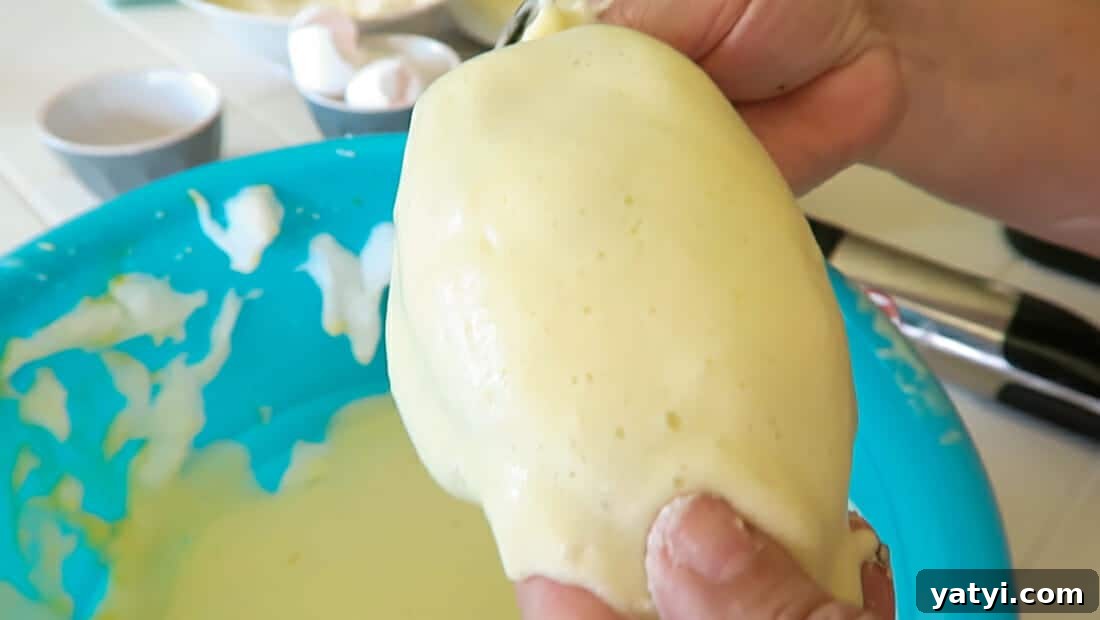 Authentic Chiles Rellenos: Mom’s Homemade Recipe with Video 15 dipping the stuffed peppers in egg batter