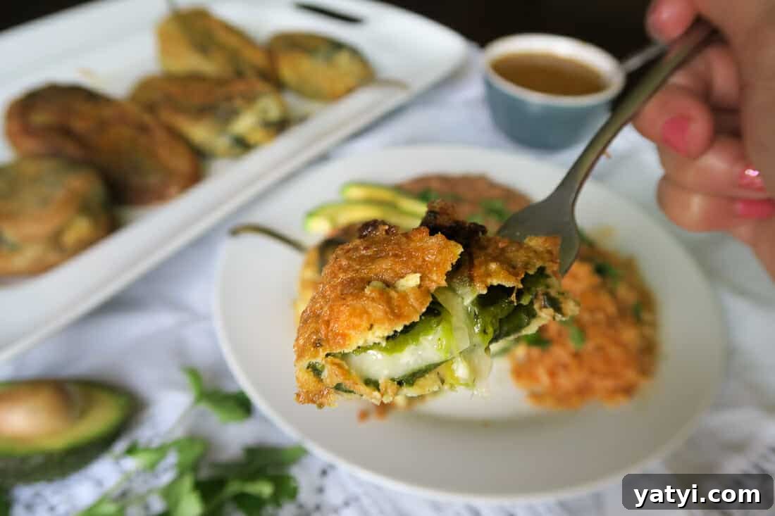 Authentic Chiles Rellenos: Mom’s Homemade Recipe with Video 17 bite shot of authentic chiles rellenos