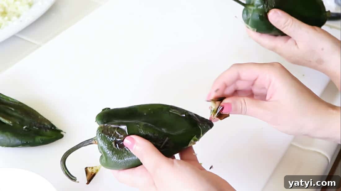 Authentic Chiles Rellenos: Mom’s Homemade Recipe with Video 9 peeling the peppers