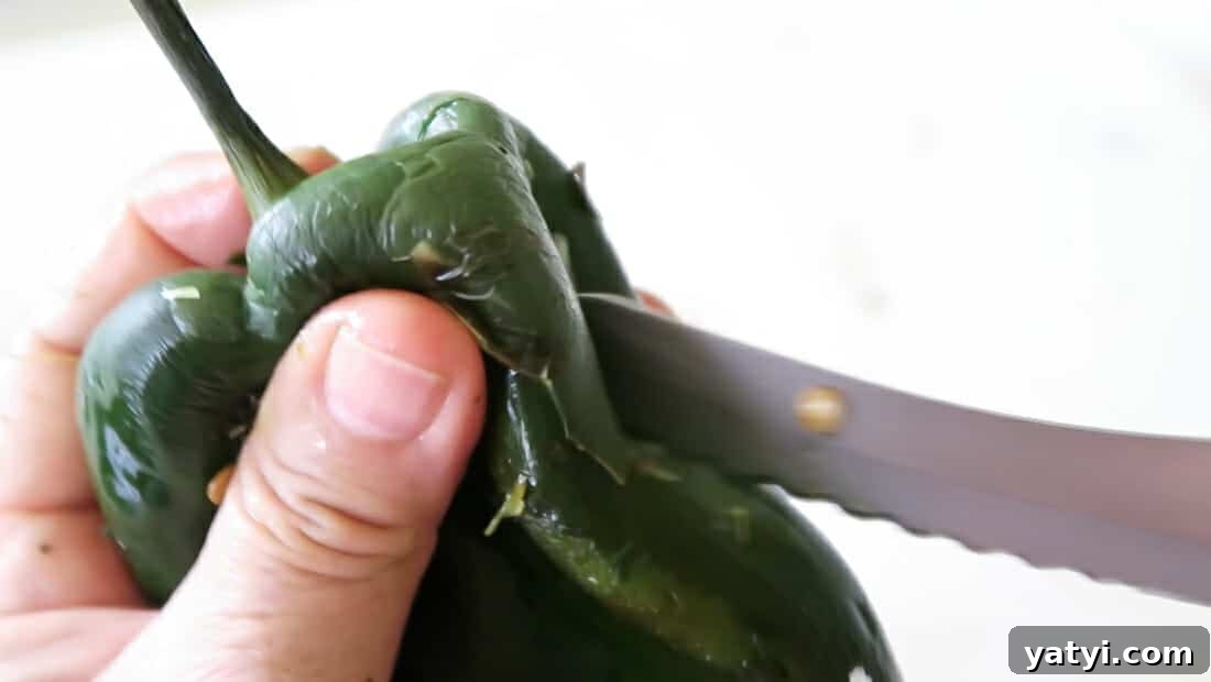 Authentic Chiles Rellenos: Mom’s Homemade Recipe with Video 10 slicing open the peppers