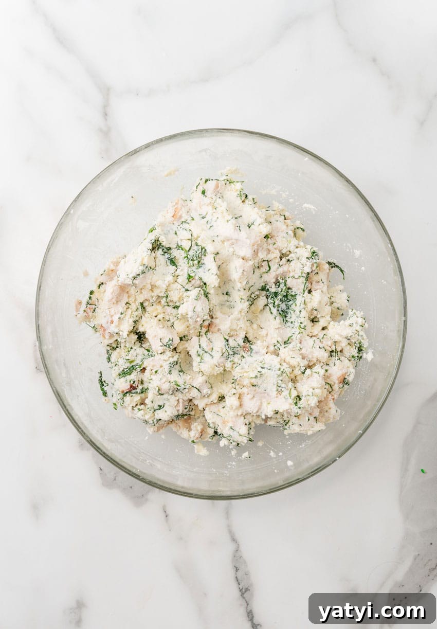 Creamy White Chicken Lasagna Roll-Ups for Family Dinner 6 white chicken lasagna filling in a glass mixing bowl