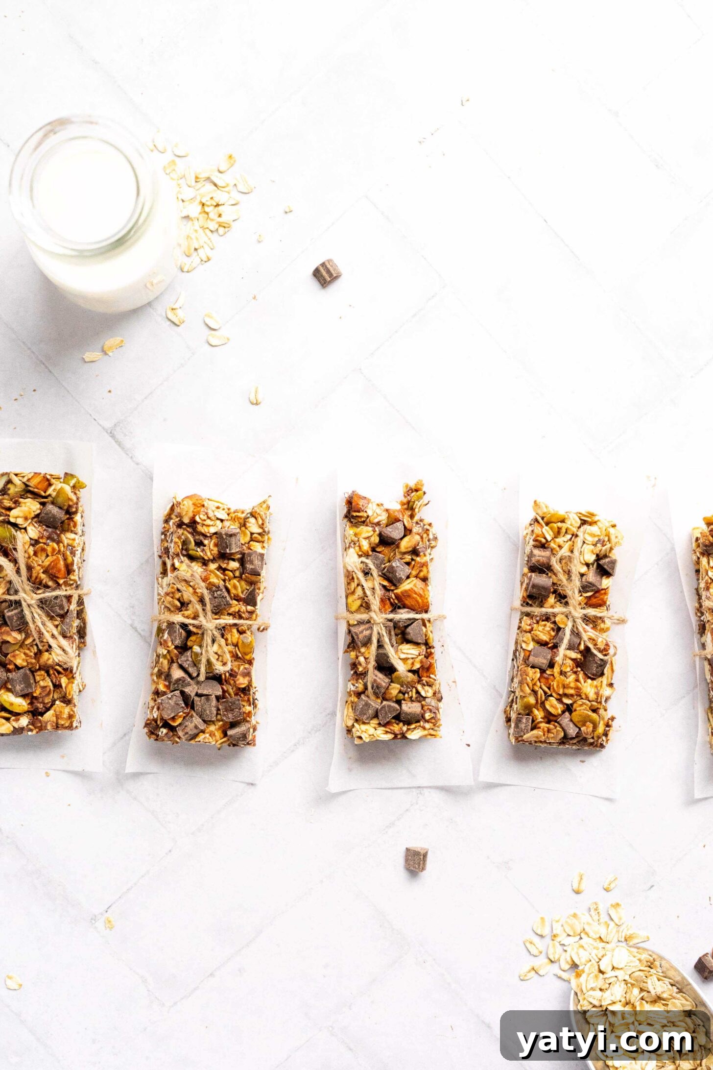 Homemade Gluten-Free Granola Bars with Oats and Almonds 3 A row of gluten free granola bars wrapped with twine