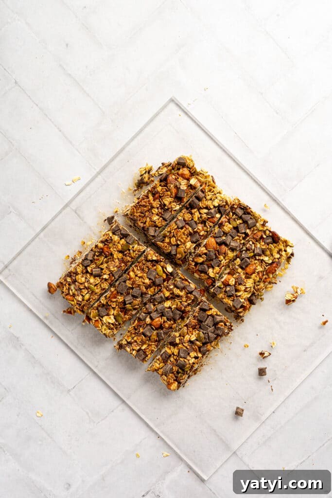 Homemade Gluten-Free Granola Bars with Oats and Almonds 9 A cutting board with 8 granola bars