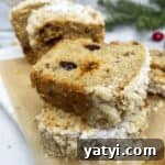 Sliced Christmas banana bread on a serving board.