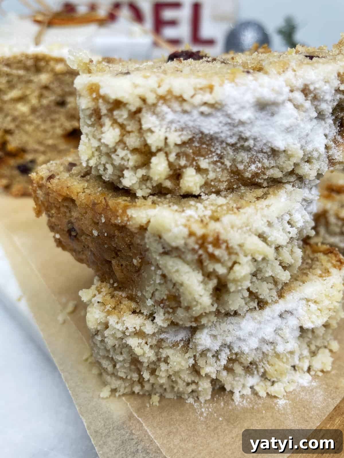 Stacked Christmas banana bread slices on a serving platter