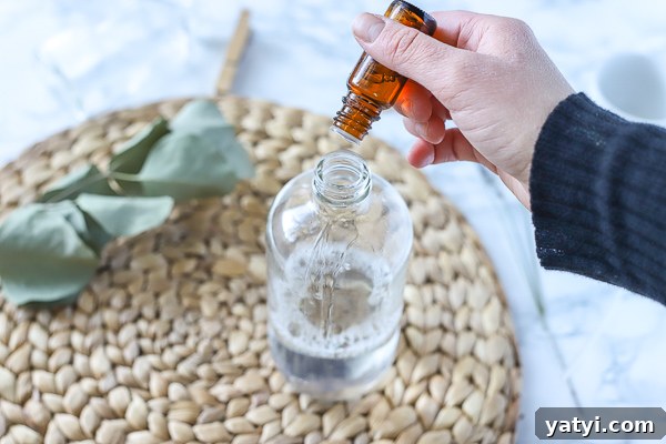 DIY All-Purpose Cleaner That Cleans Glass and Surfaces 5 adding essential oils to DIY all-purpose cleaner