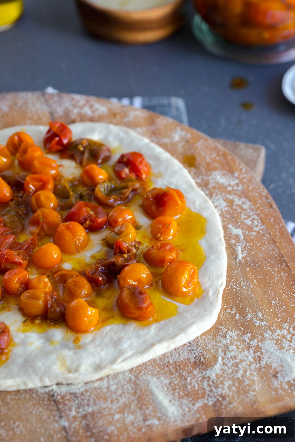 Building Tomato Confit Burrata and Arugula Pizza