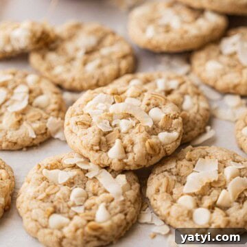 Baked coconut oatmeal cookies on pan.