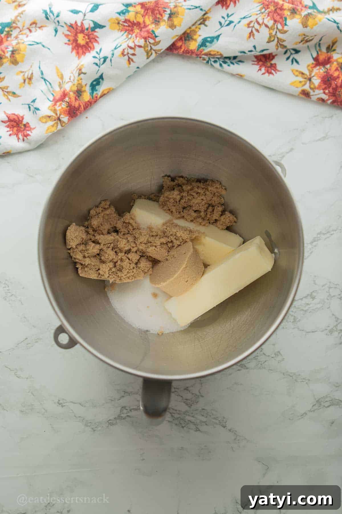 Butter and brown sugar in bowl.