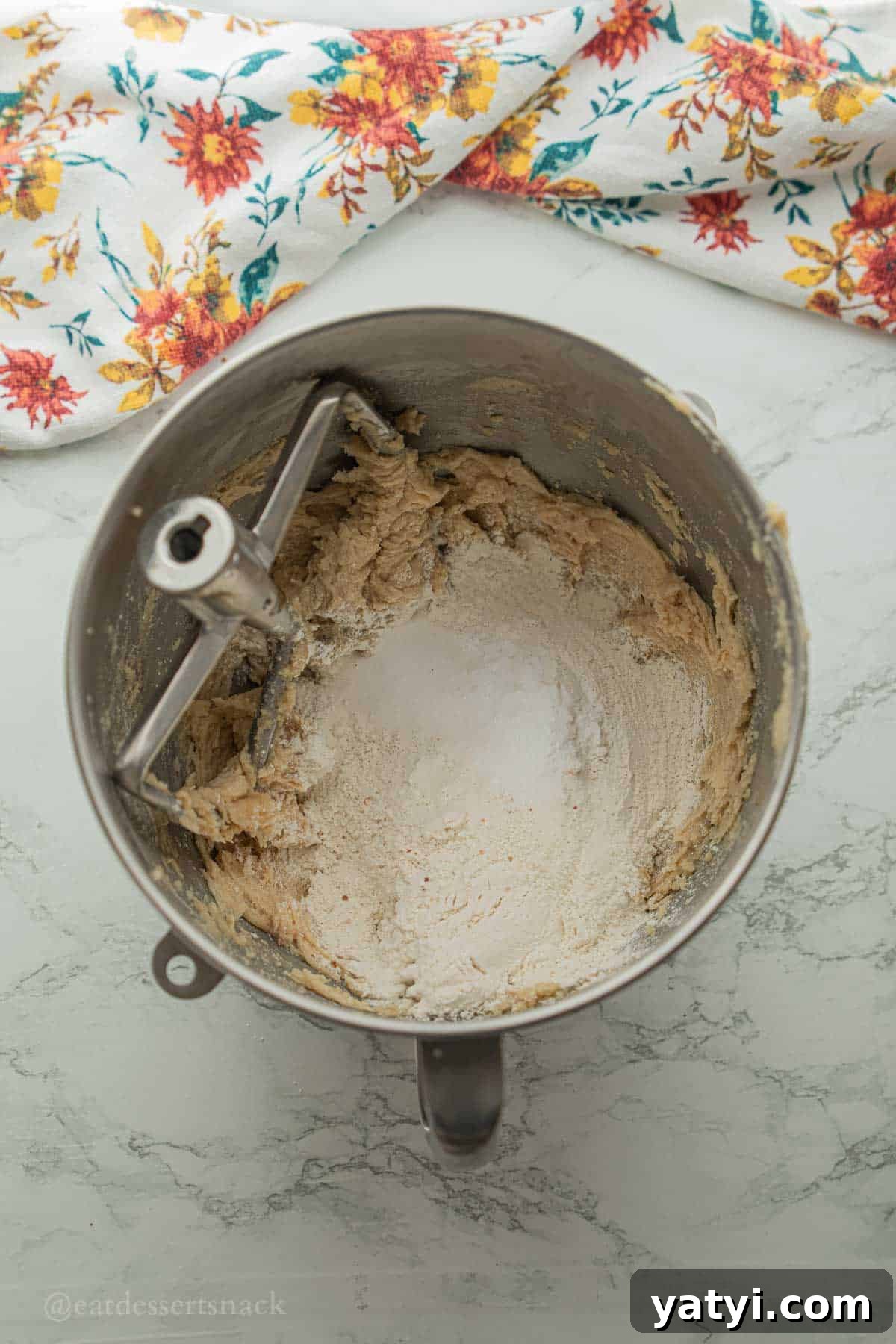 Dry ingredients for oatmeal coconut cookies in mixing bowl.