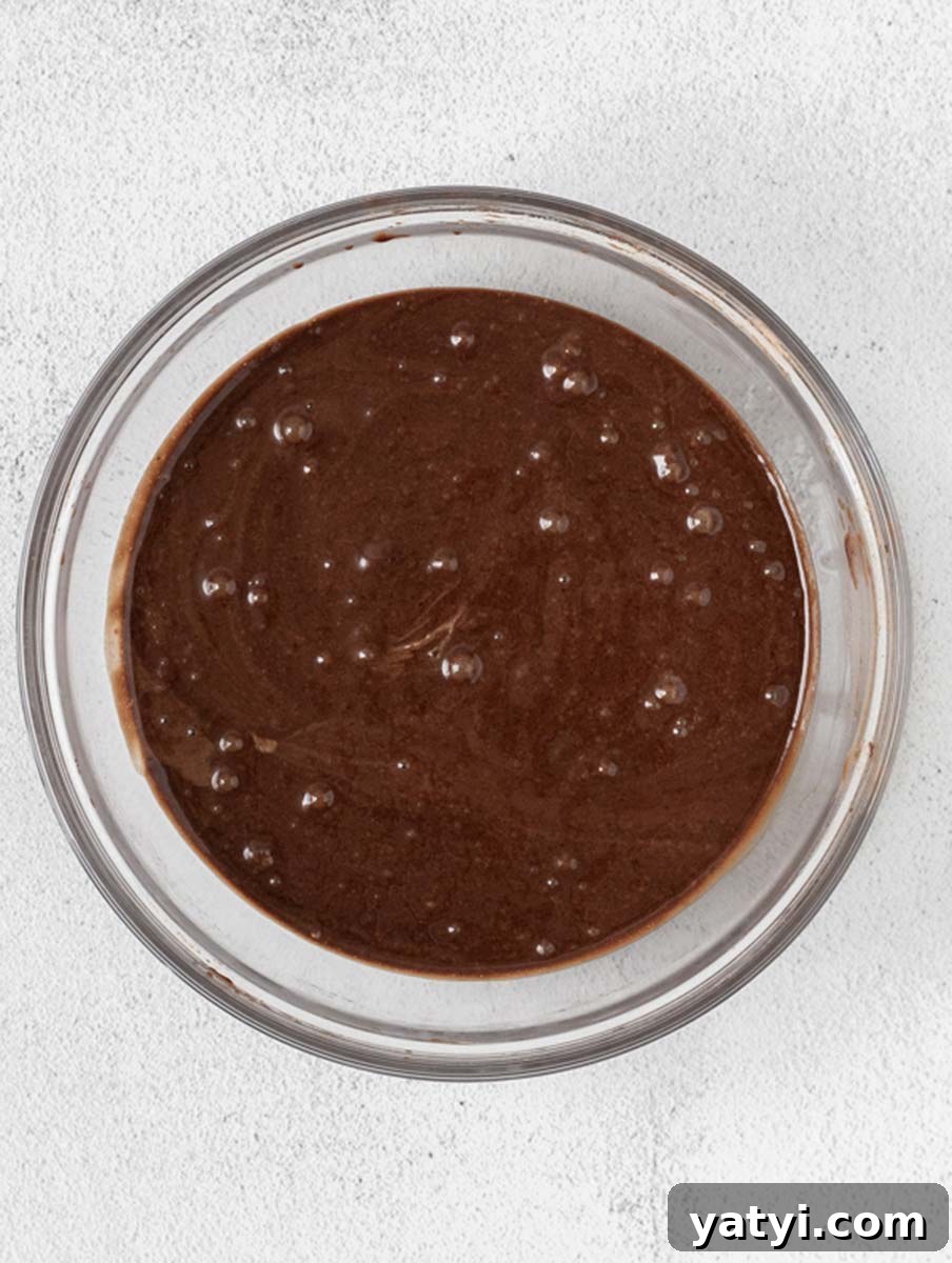Decadent Chocolate Cupcakes: Moist, Rich Recipe for Home Bakers 4 chocolate muffin batter in a bowl