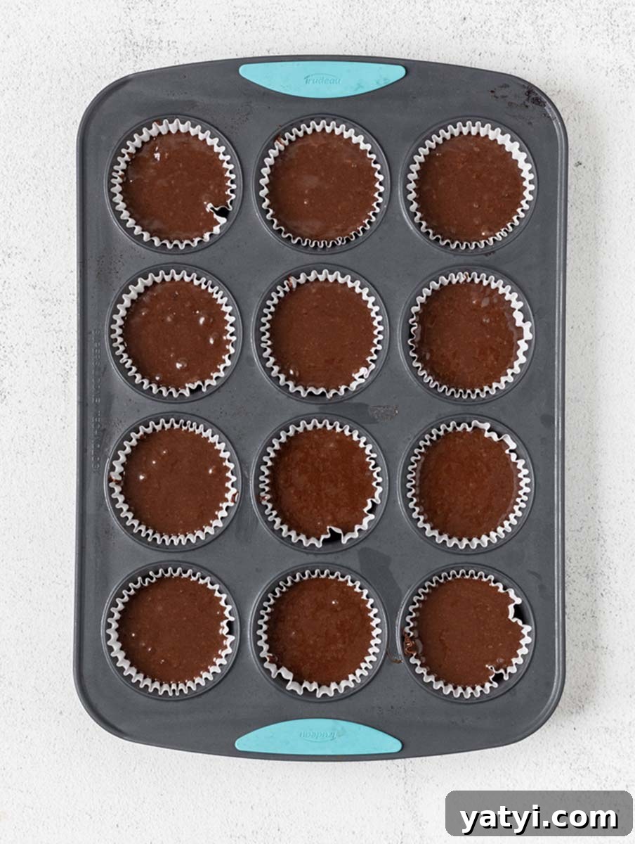 Decadent Chocolate Cupcakes: Moist, Rich Recipe for Home Bakers 5 chocolate cupcake batter in muffin pan