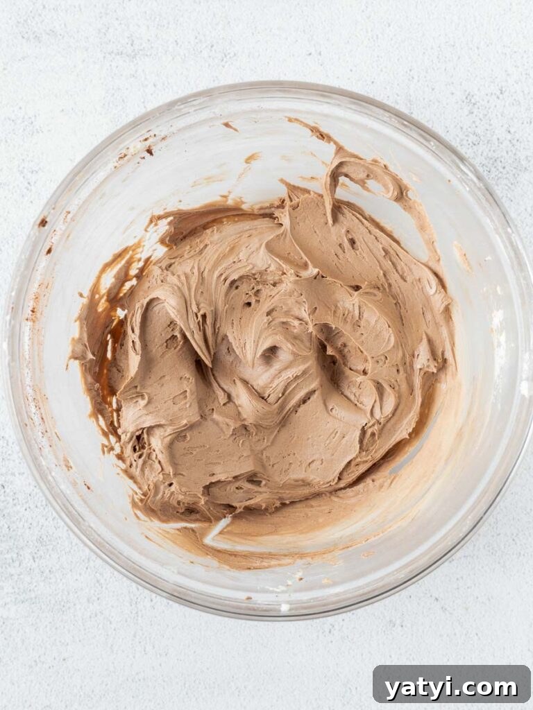 Decadent Chocolate Cupcakes: Moist, Rich Recipe for Home Bakers 6 chocolate frosting in a bowl