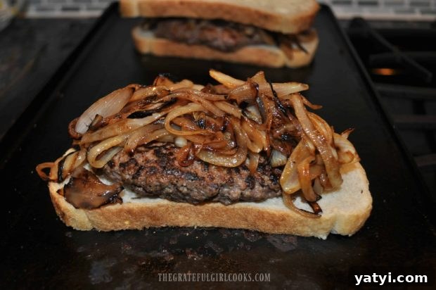 Grilled Patty Melt / The Grateful Girl Cooks! Patty melt is piled high with cooked onion slices.
