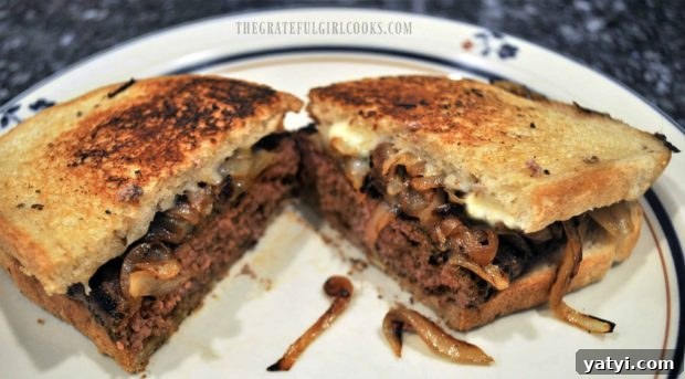 Grilled Patty Melt / The Grateful Girl Cooks! Grilled patty melt is cut in half on a plate.