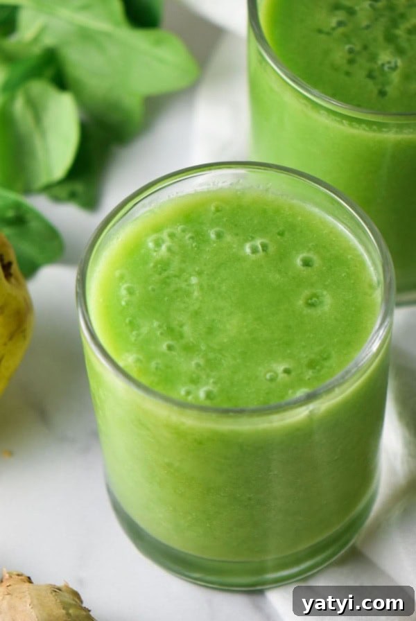 Ginger Juice Recipe: Make Fresh Ginger Juice with a Blender or Juicer 9 A cup with an anti inflammatory green smoothie next to a pear.