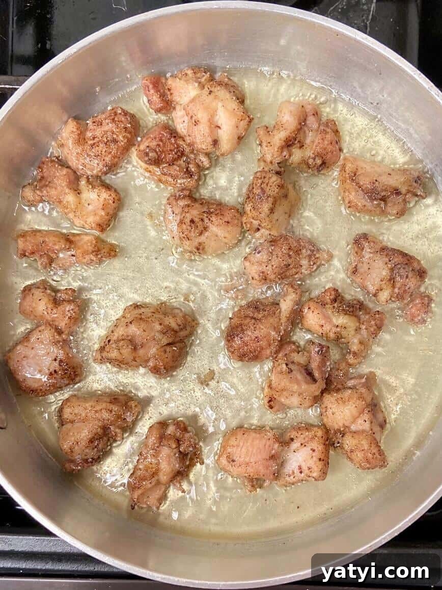 Frying the chicken.