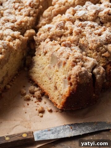sliced gluten free pear cake with crumb topping