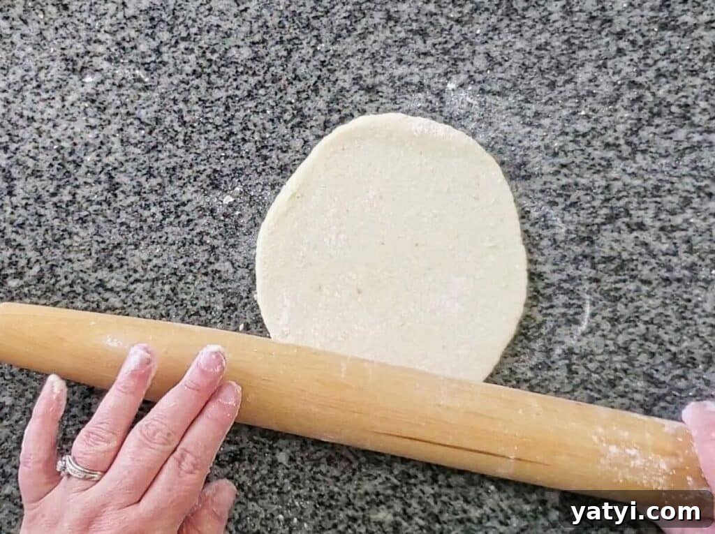 Gluten-Free Pita Bread Recipe: Soft, Flavorful, and Simple 6 rolling out each ball with a wooden French rolling pin.