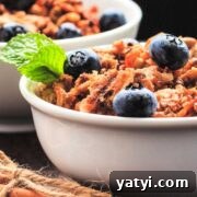 Bowls of keto granola cereal with berries and cinnamon.