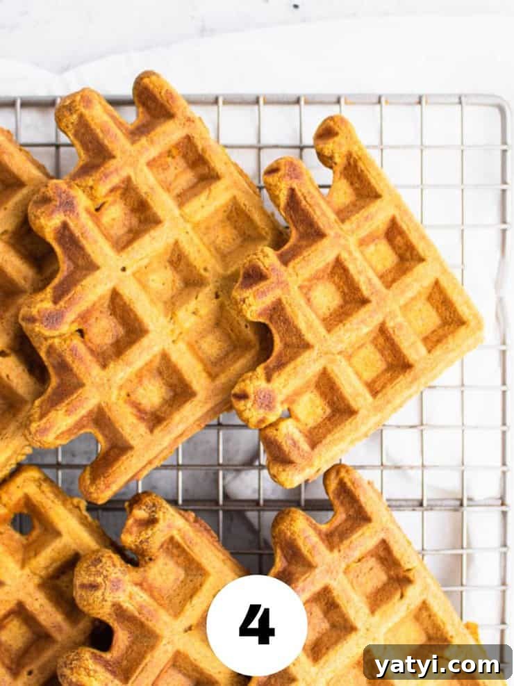 Fluffy Buttermilk Pumpkin Waffles Recipe for Fall Breakfast 6 Overhead view of pumpkin waffles on a cooling rack.