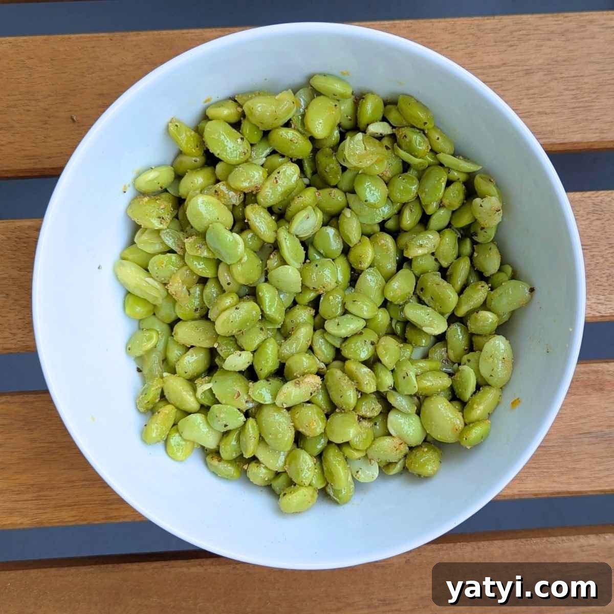 Crispy Air Fryer Edamame Recipe for a Perfect Snack 3 Edamame beans in a bowl tossed with seasonings