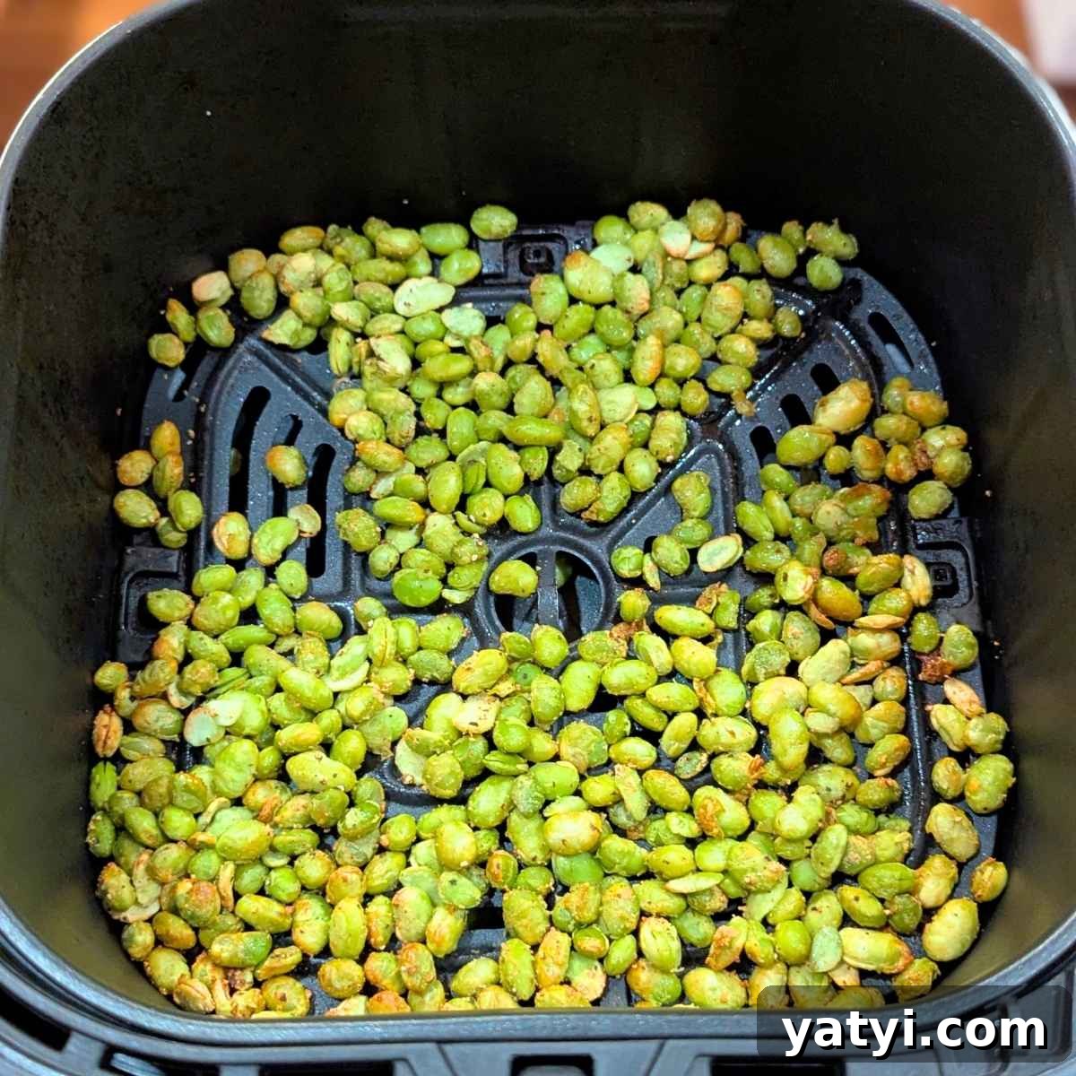Crispy Air Fryer Edamame Recipe for a Perfect Snack 7 Edamame beans after air frying in air fryer basket