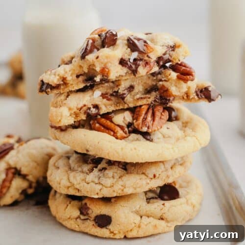 A stack of pecan chocolate chip cookies.