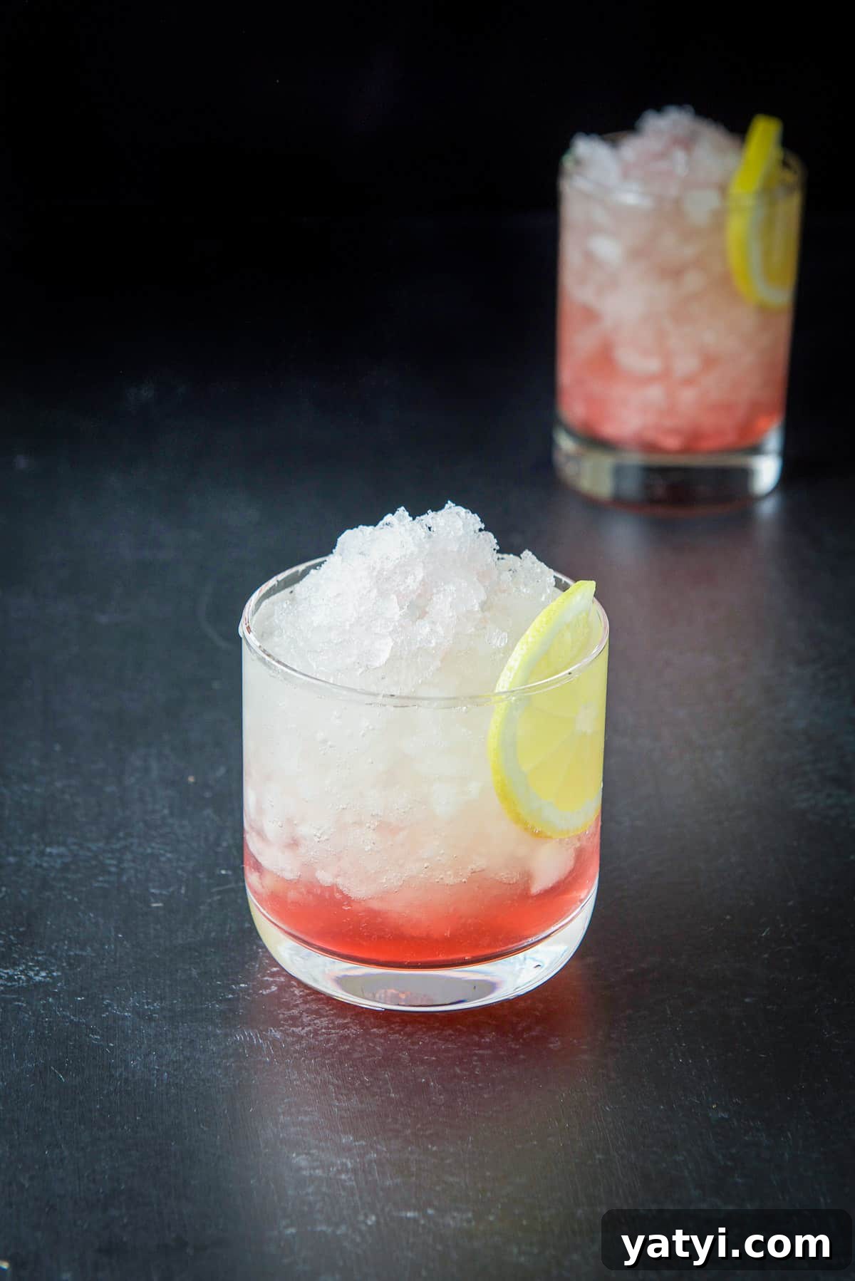 How to Make a Classic Bramble Cocktail: Gin, Blackberry & Lemon 8 Short glass filled with ice, a red cocktail and lemon slice