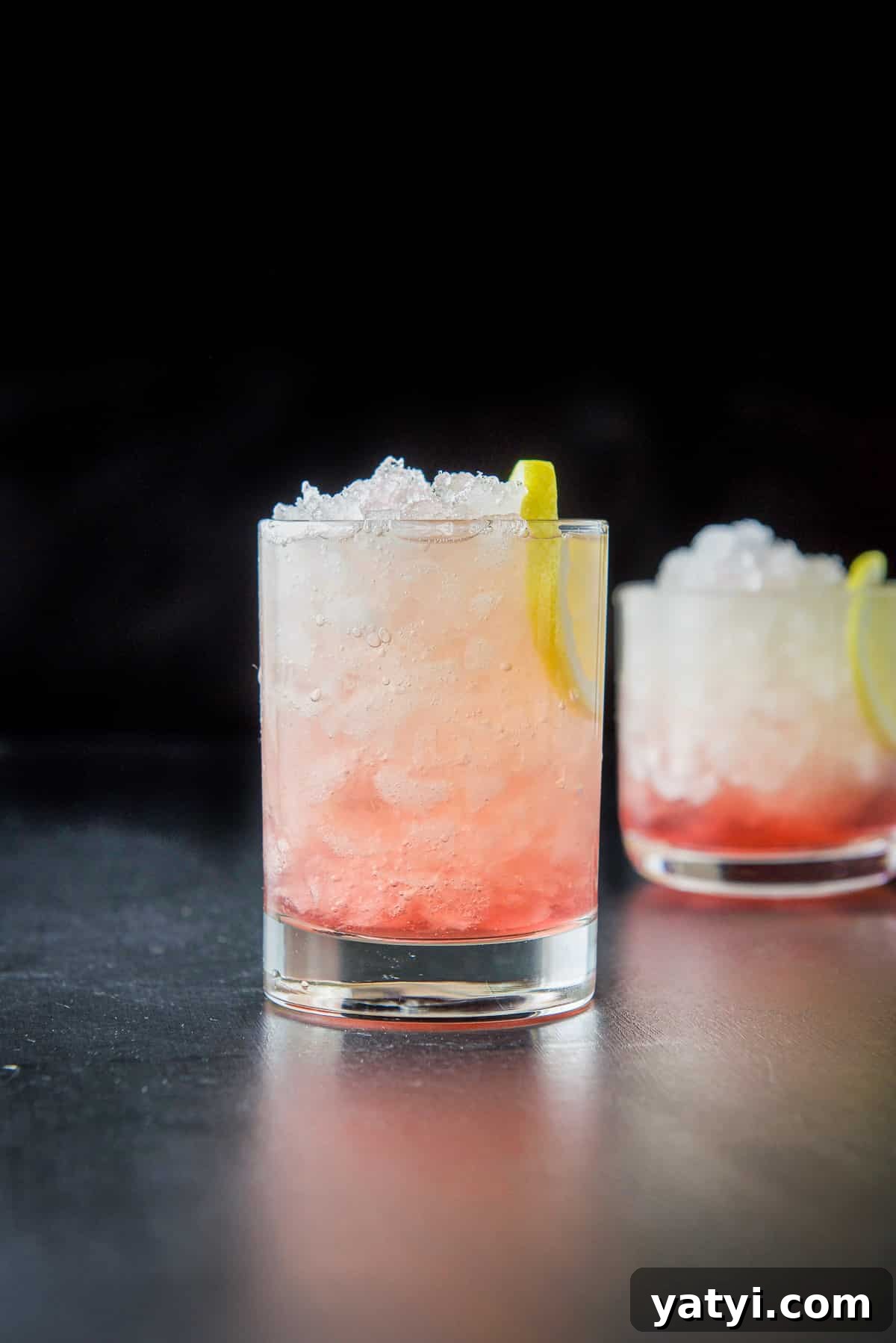 How to Make a Classic Bramble Cocktail: Gin, Blackberry & Lemon 9 Taller glass filled with ice, bramble and lemon slices