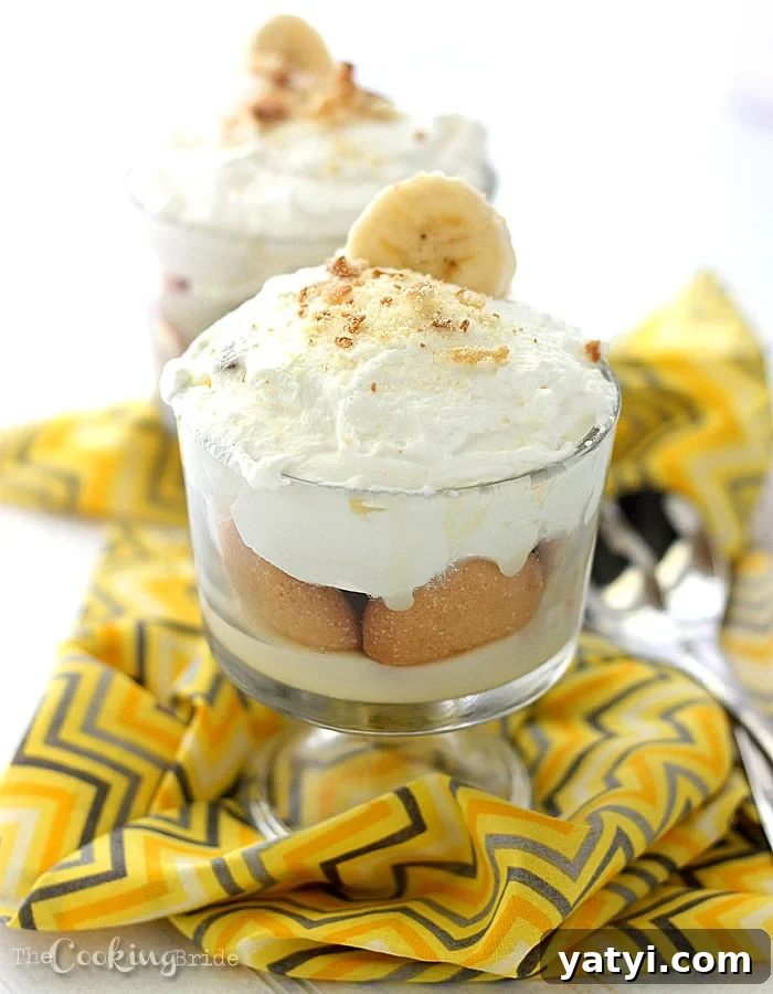 Homemade Banana Pudding Recipe from Scratch 3 trifle bowl of banana pudding topped with whipped cream and crushed vanilla wafers